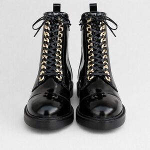 Statement combat boots with edgy gold chain hardware from Jeffrey Campbell 9.5